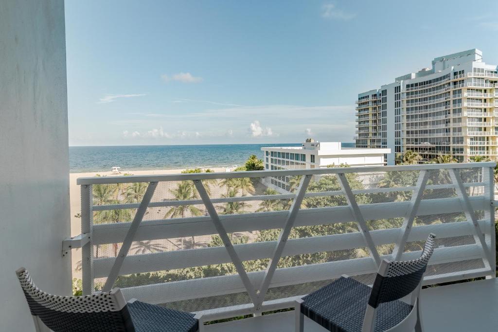 View from a hotel balcony of the beach and hotel beyond. One of the Florida hotels with a private beach. 