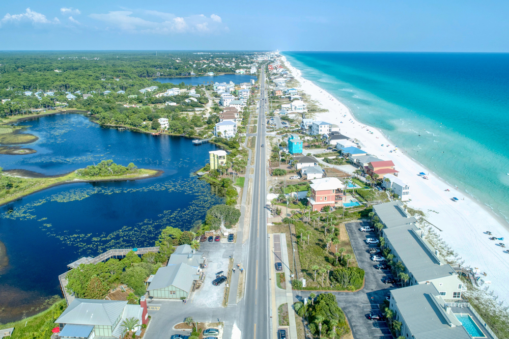 an arial view of 30A with the road and beach