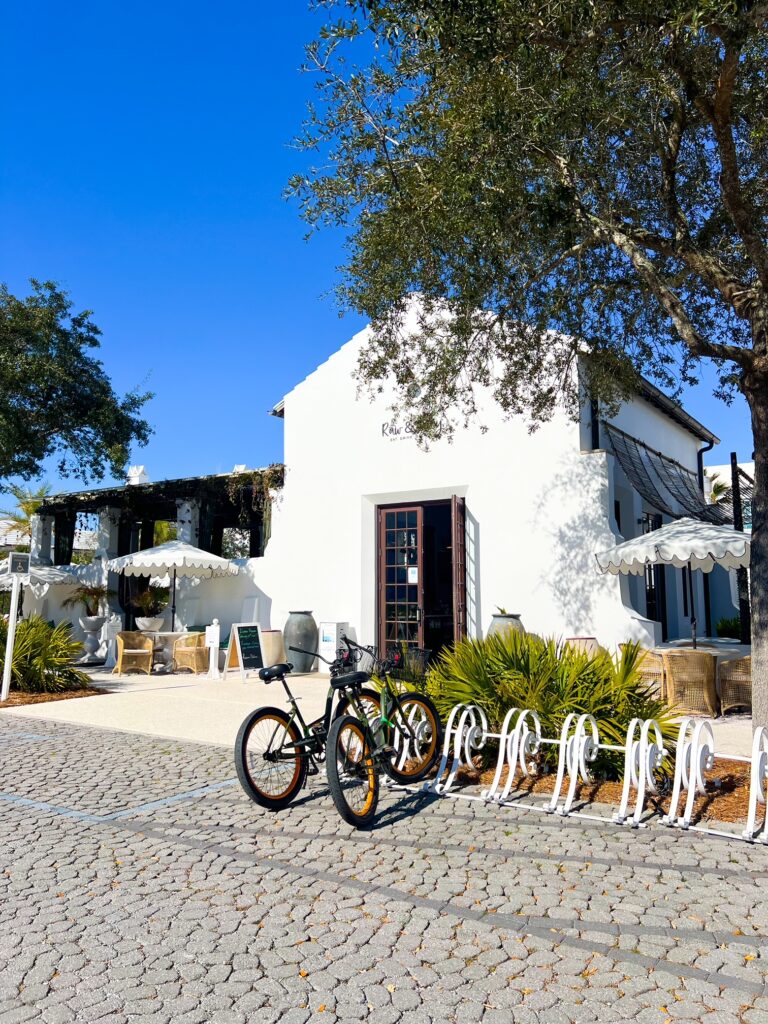 Alys Beach with bikes in front of raw and juicy one of the restaurants