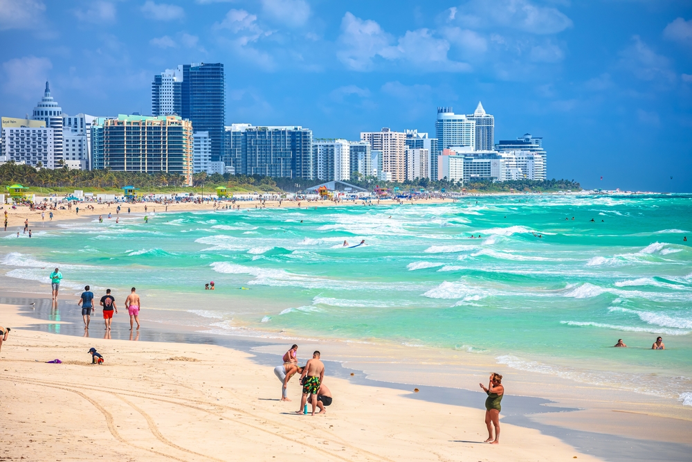 One of the warmest beaches in Florida is Miami, meaning you don't have to go during busy season! In the winter, the water is still teal and bright blue, and guests still jump into the wave caps surrounded by the city scape of Miami. 