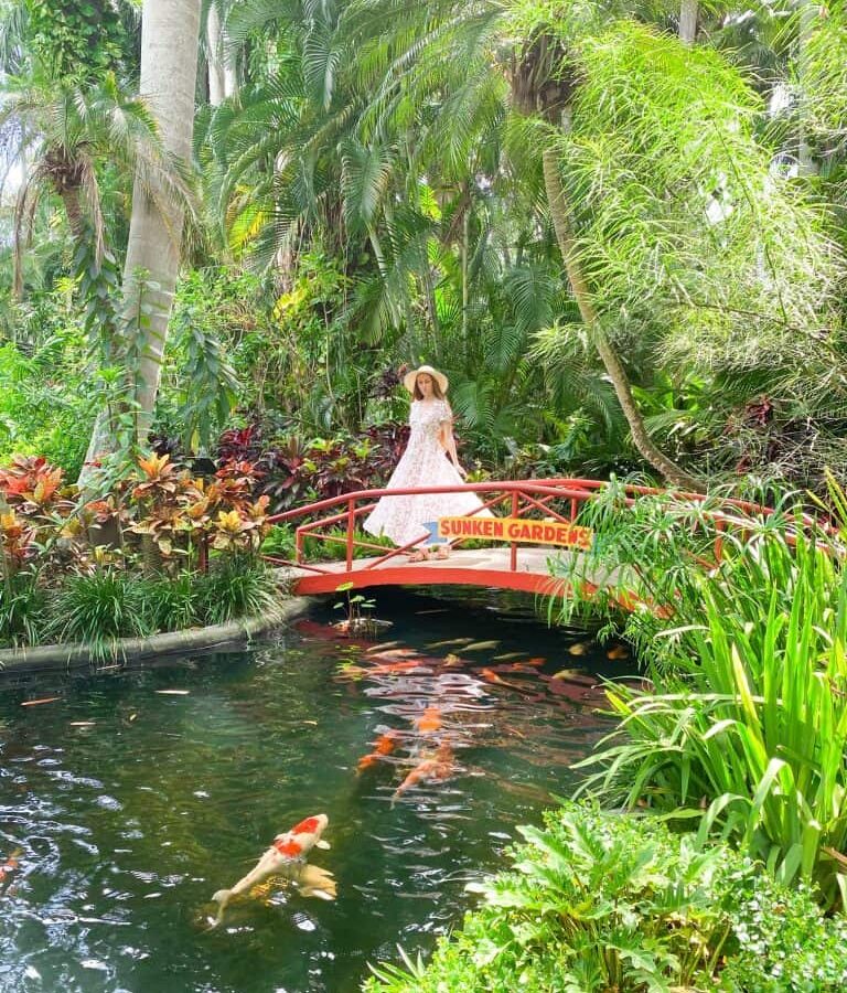 a girl standing on a bridge at sunken museum