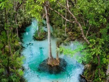 a couple standing in one of the Florida Springs hidden gems in Florida