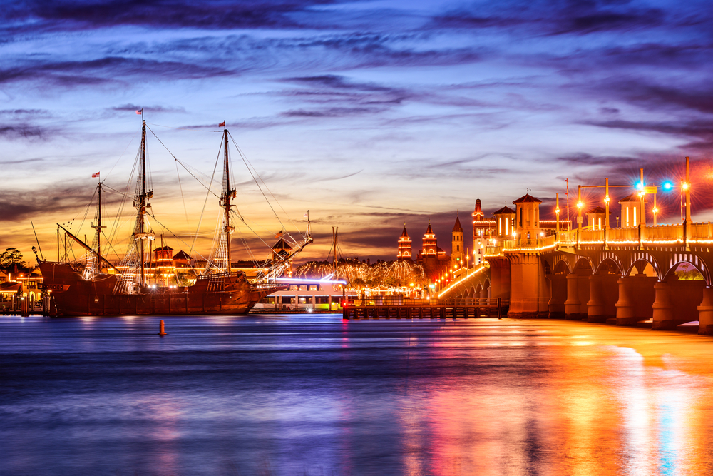 saint augustine lit up at night during a ghost tour in the fall