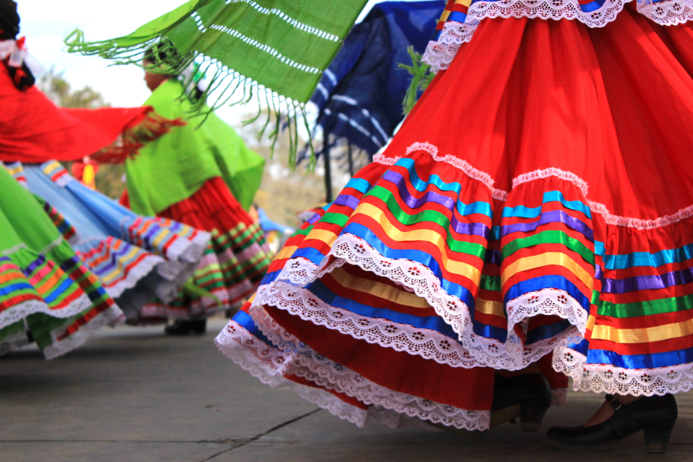 colorful hispanic dresses twirling outside at viva brevard festival 