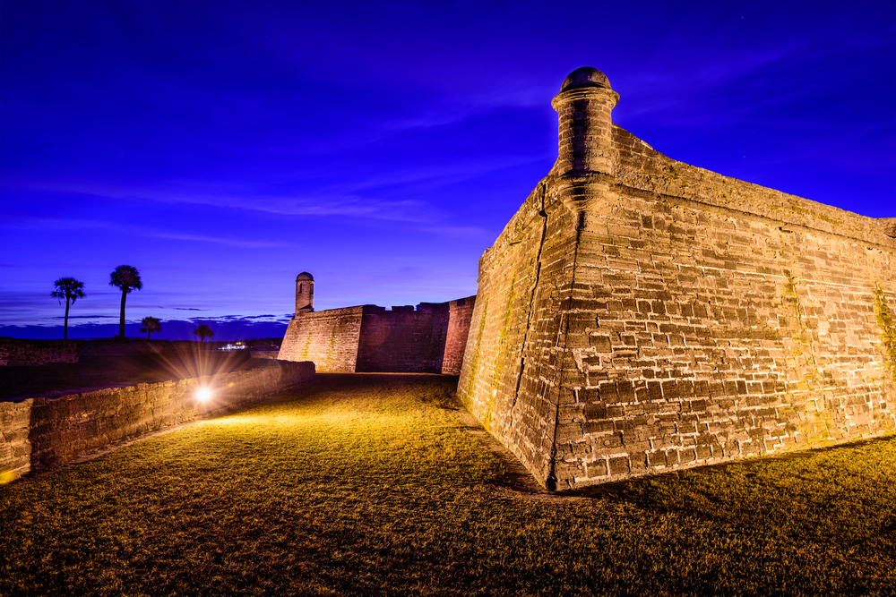 Photo of sunset over the Castillo de San Marcos which you can visit by taking one of the many Saint Augustine ghost tours. 