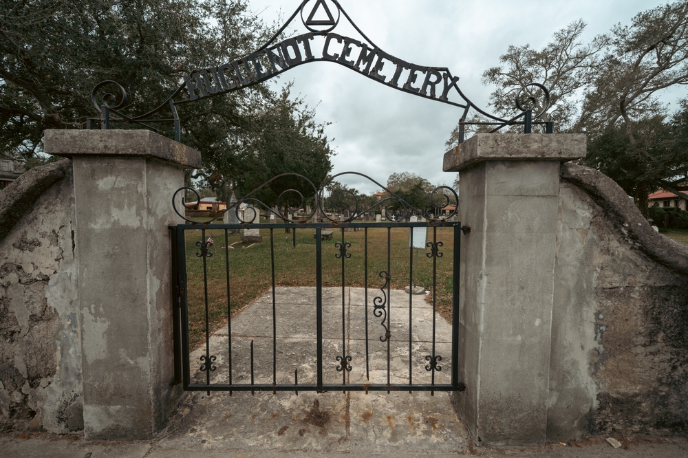 Spooky photo of the gate at Huguenot Cemetery, a stop on many Saint Augustine ghost tours. 