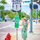 woman standing in green dress at mile 0 in key west