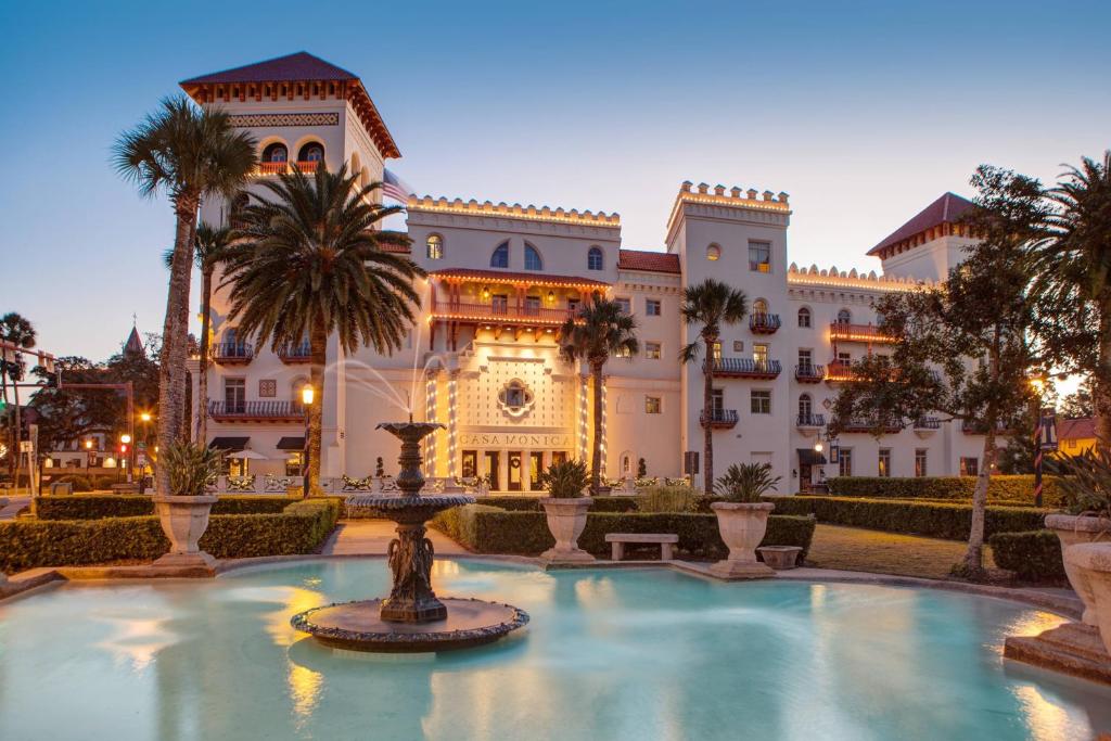 Pictures of a Spanish style hotel with a fountain out front. It is one of the best spa resorts in Florida. 