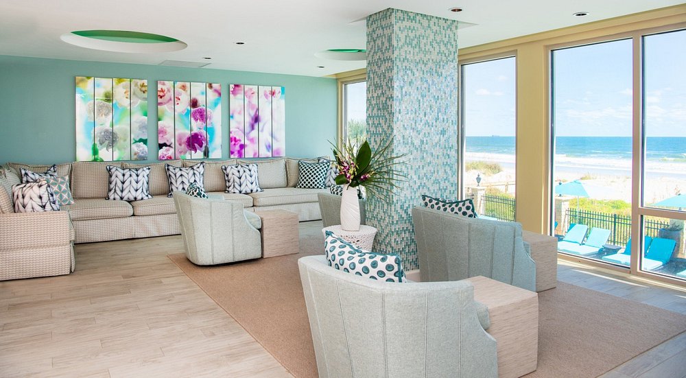 A room in a spa with chairs looking out over the ocean. The article is about spa resorts in Florida. 