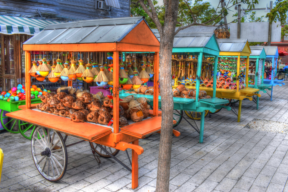Colorful carts line the street of Key West, full of food, gifts, and more.