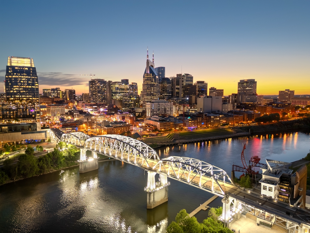 The Nashville skyline at night shows bridges over rivers, skyscrapers, and the overall power of nightlife.