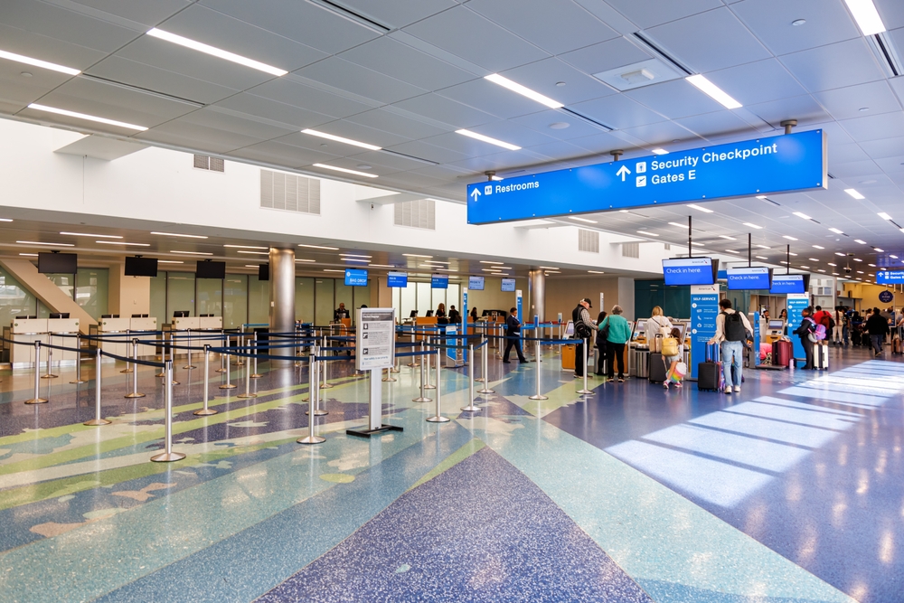 When considering cheapest places to fly from Fort Lauderdale, know the Fort Lauderdale airport well: as seen in this photo it is clean and well organized with sings point to security, bathrooms, and gate options.