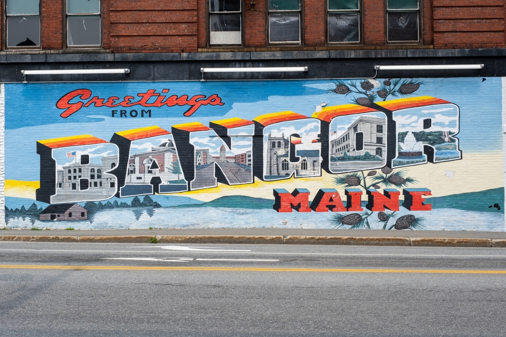 The "greetings from Bangor Maine" sign welcomes guests when they know this is one of the cheapest places to fly from Fort Lauderdale, the small town offers big fall adventures.