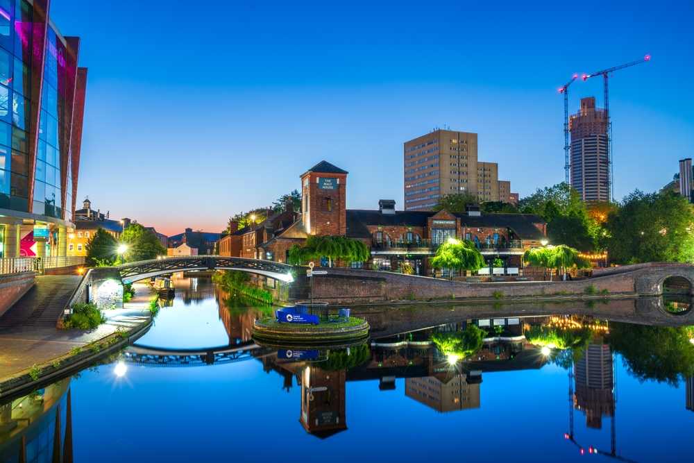 At night the city of Birmingham comes alive, the towns lights and reflections in the water across the city's bridges.