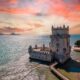 Aerial view of Tower of Belem at sunset, Lisbon, Portugal on the Tagus River. it is sunset and the water is blue