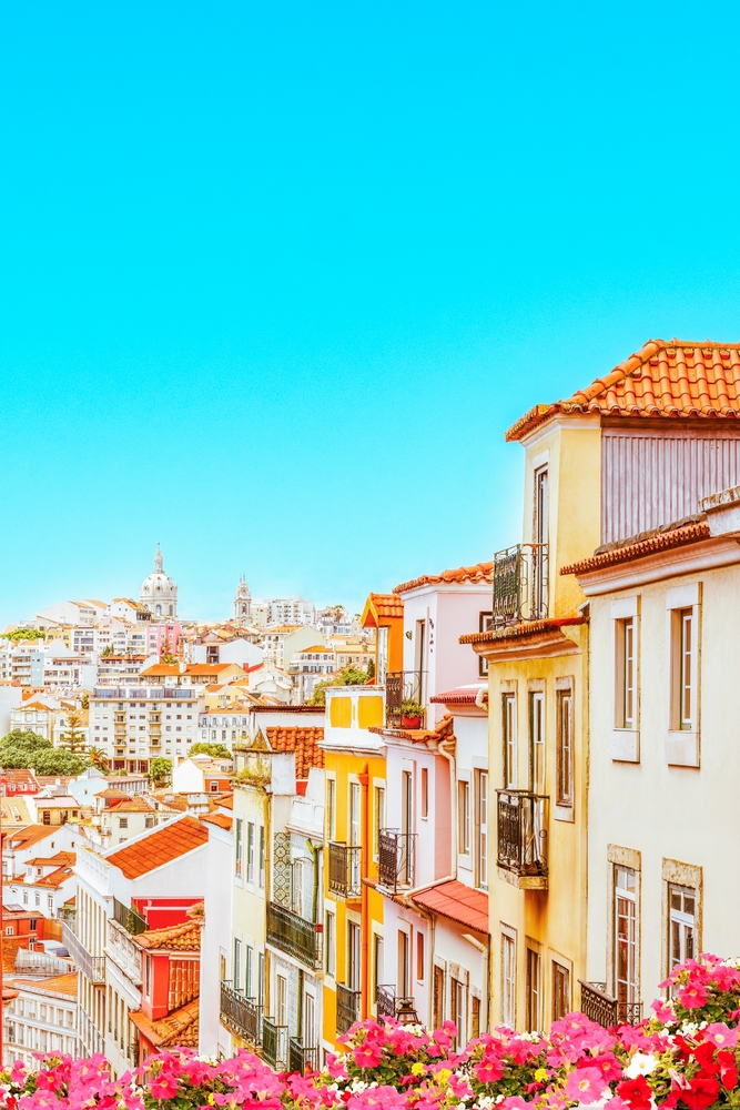 Portugal - Lisbon Cityscape - Colorful buildings at Lisbon old town. The article is about cheapest places to fly from Florida.